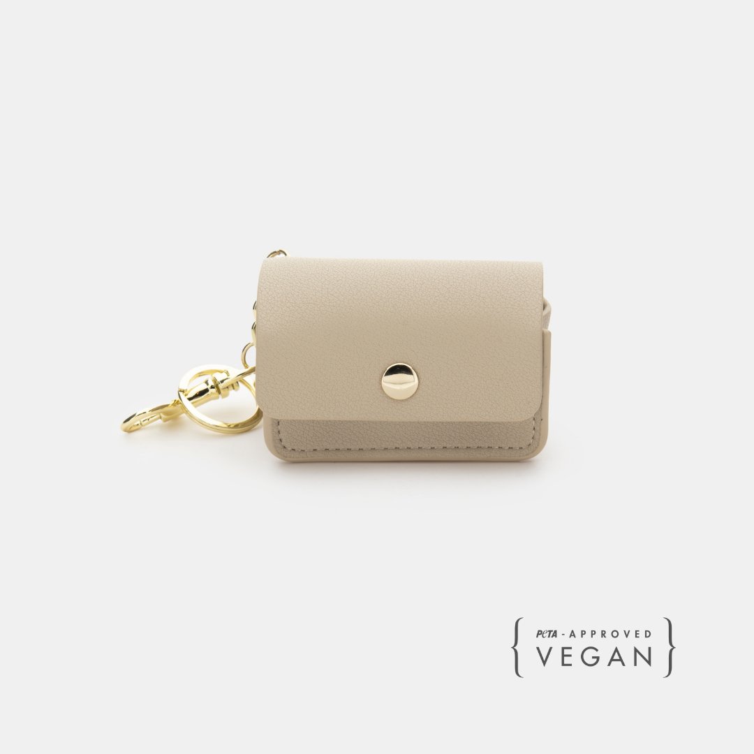 Beige vegan leather waste bag holder with snap button and gold keyring clip