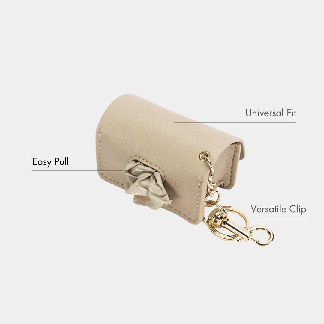 Beige waste bag dispenser case with easy-pull opening and gold clasp keyring