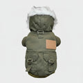 Olive green dog parka with faux-fur hood and built-in chest harness straps